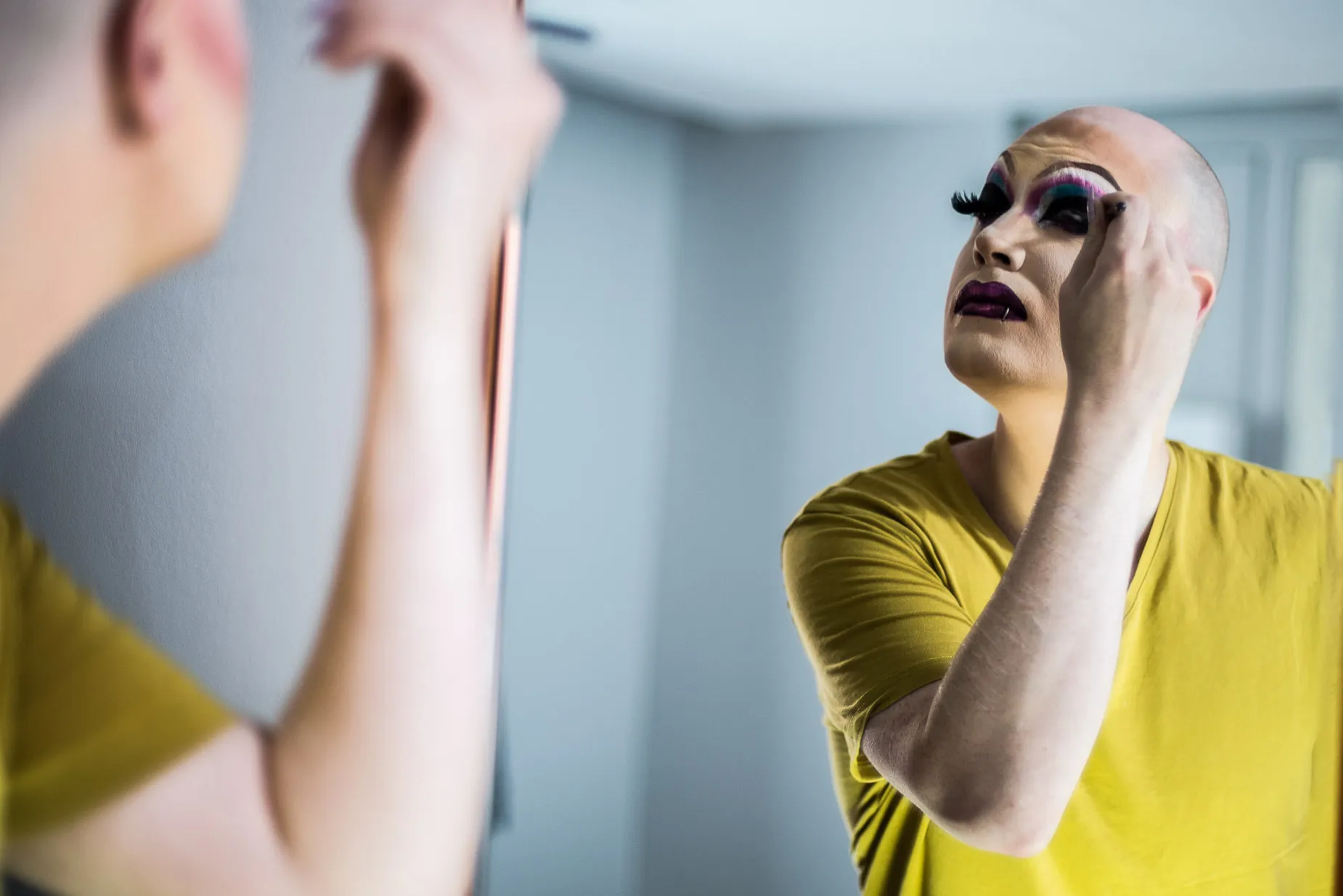 Soren preparing make up for a drag performance at the After Dark club in Reading England