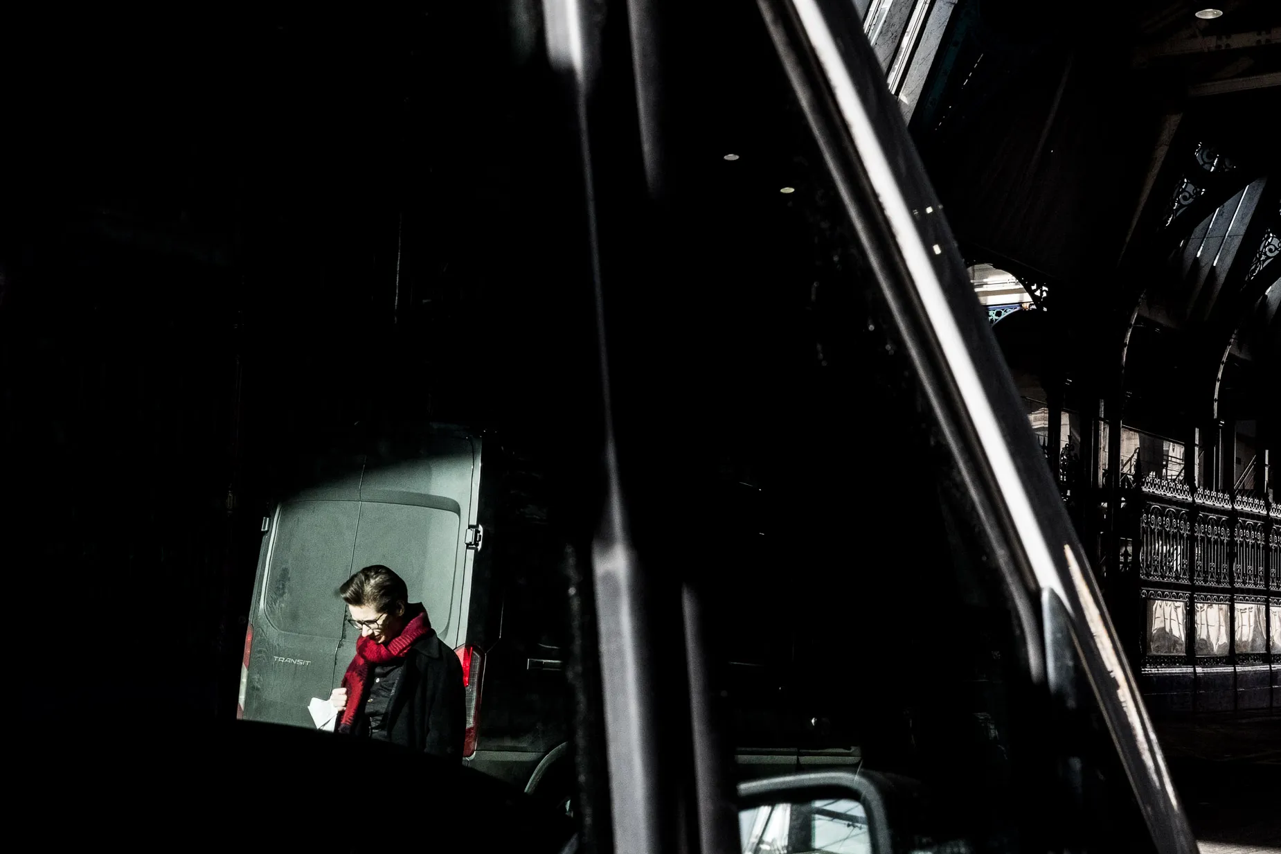 Light and shadow image of a women walking deep in thought
