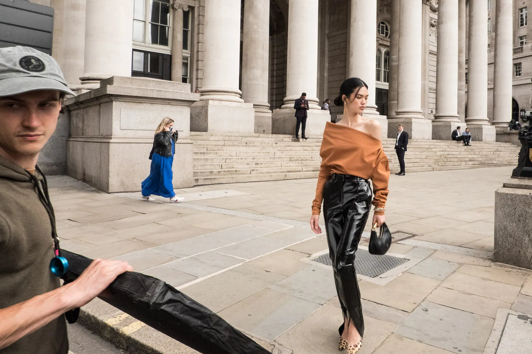 A fashion model poses outside the Royal Exchange. From the Square Mile Street photography project by Darran K Roper
