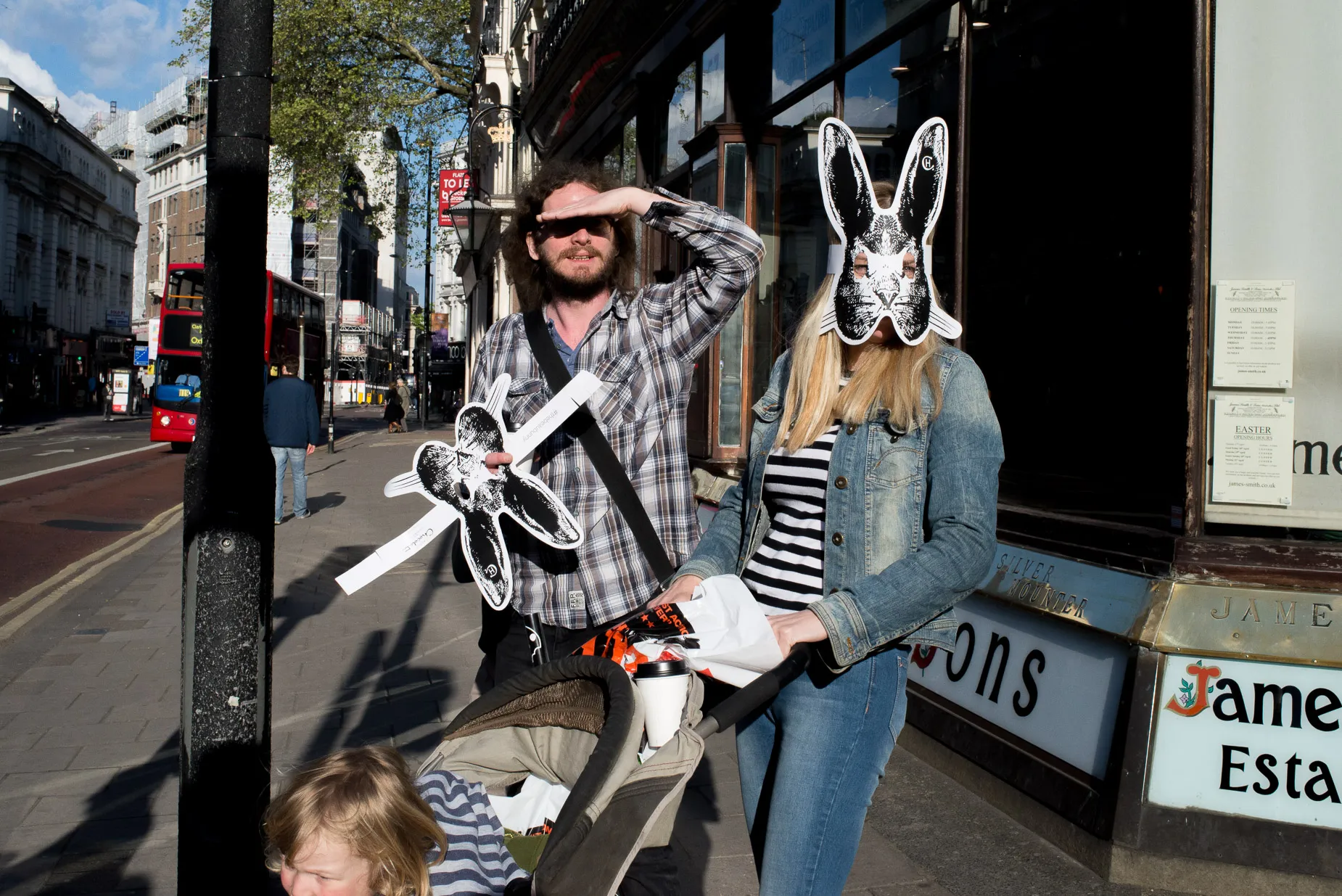 Woman wearing rabbit mask looking toward camera