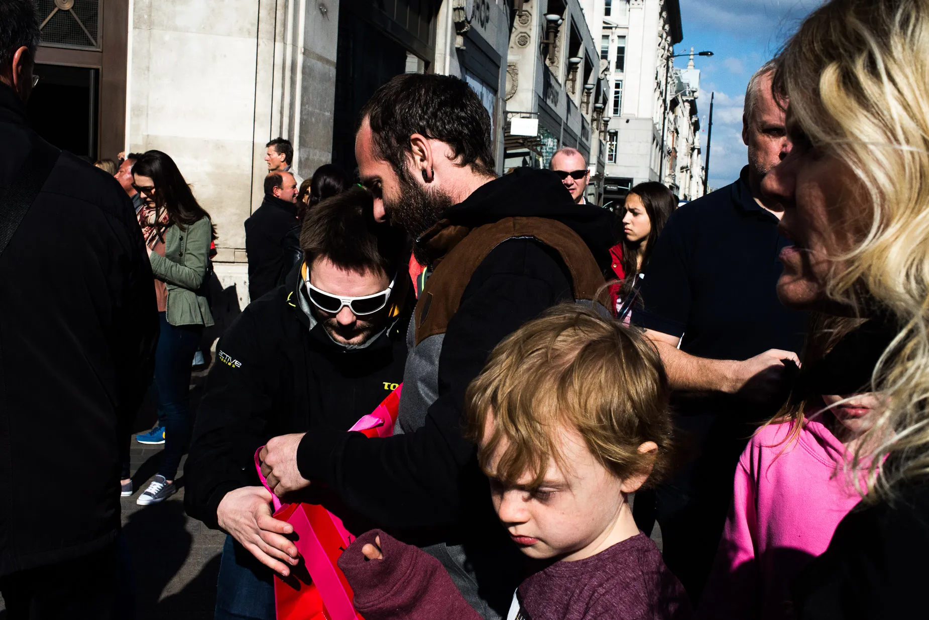 Layered street scene in black and pink taken Oxford Circus London