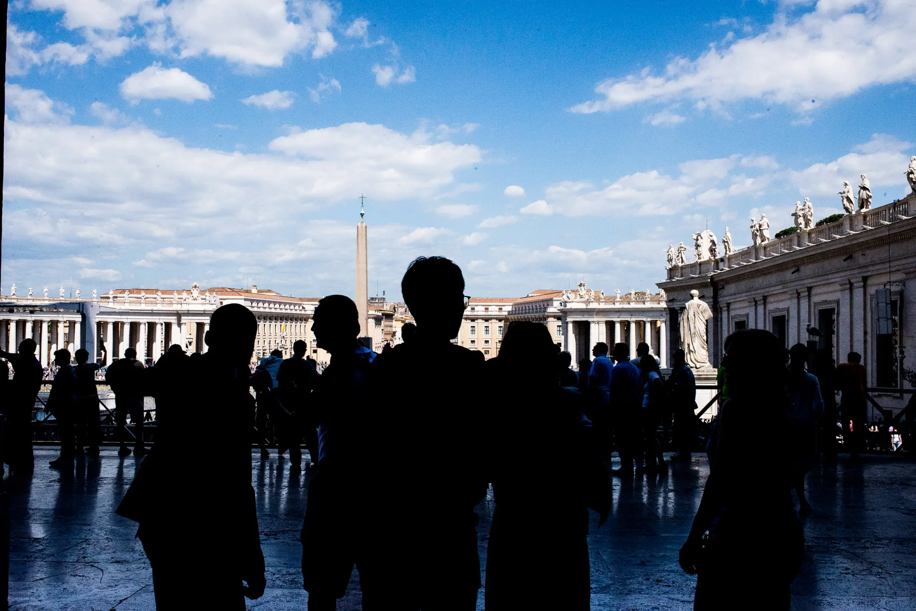 People silhouette against background of the Vatican