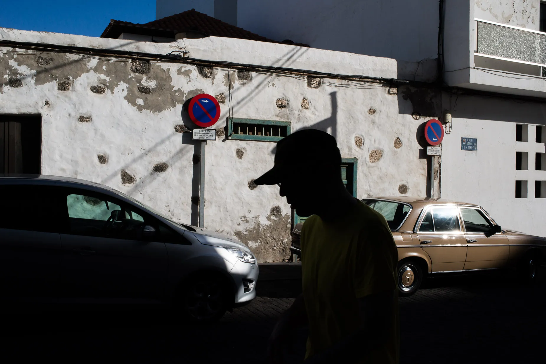 Silhouette of man against wall in Spain