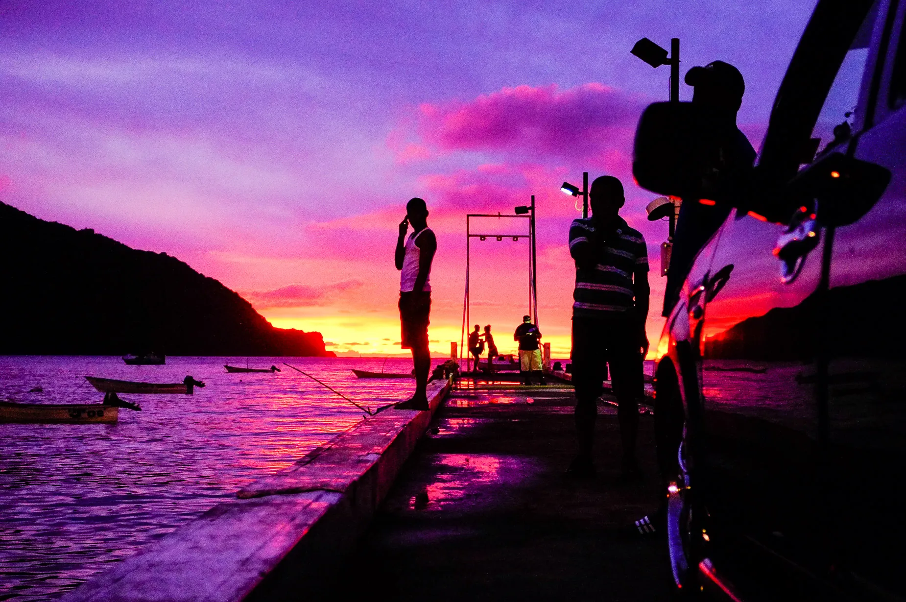 Sunset scene people silhouetted against background