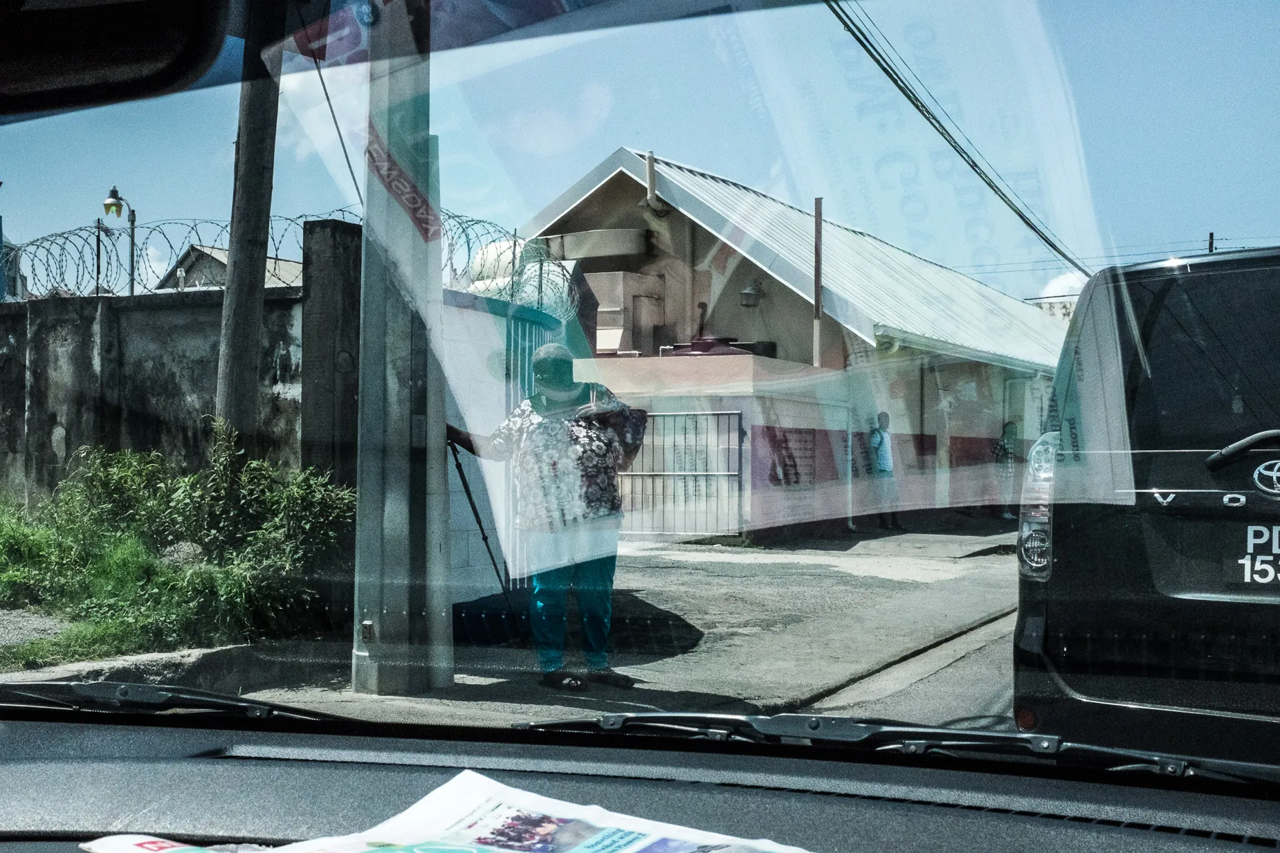 Reflection scene of street scene seen through car window